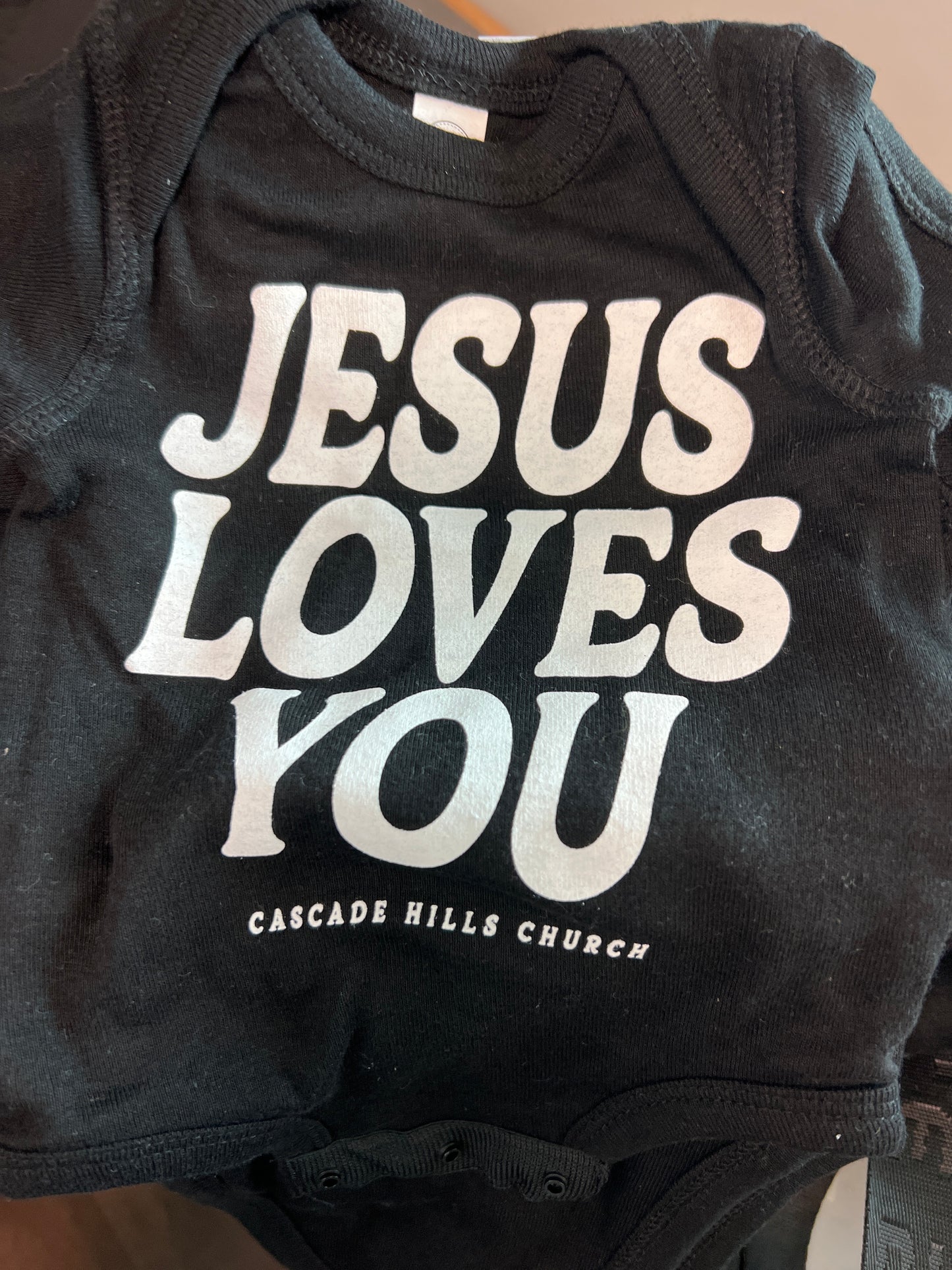Infant Jesus Loves You Onesie (Black)